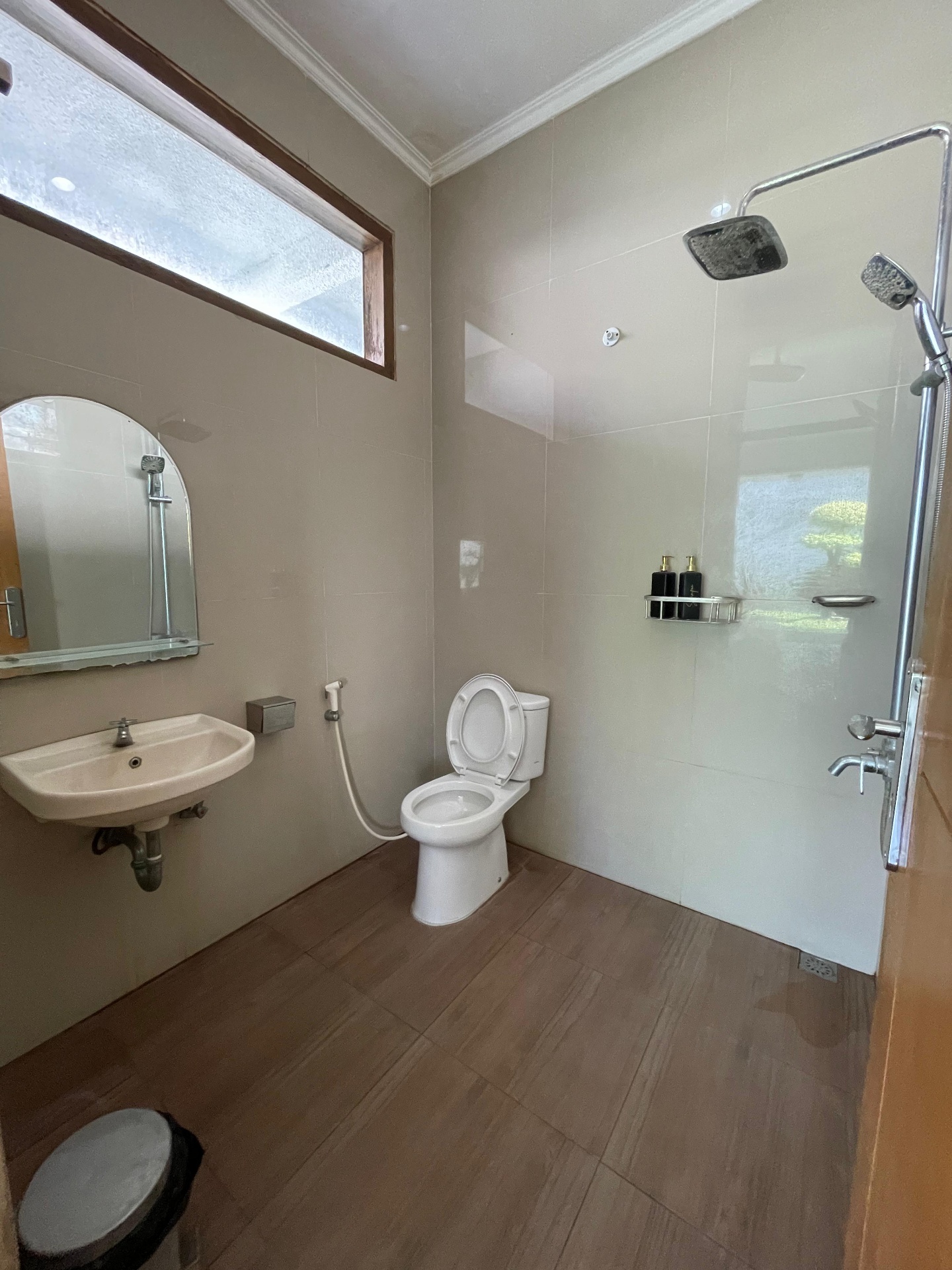 Garden-view bathroom with walk-in shower